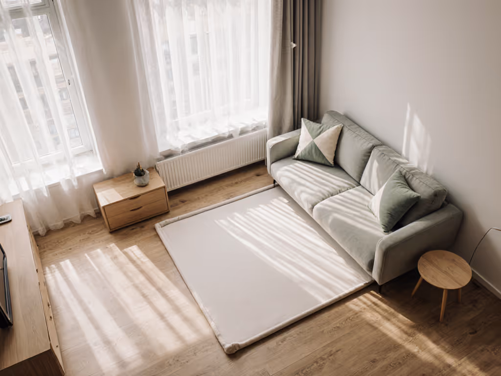 urban_apartment_living_room_with_baby_play_mat_stored_under_sofa